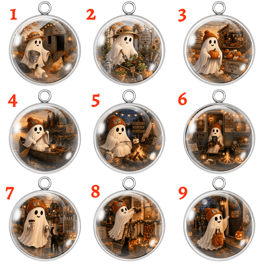 Nine circular pendant or charm designs arranged in a 3x3 grid on a white background, each labeled with a red number 1 through 9. Each charm features a cartoon ghost character in a Halloween-themed scene with autumn elements like pumpkins, lanterns, and warm glowing lights inside a clear round case with a silver metal ring at the top.