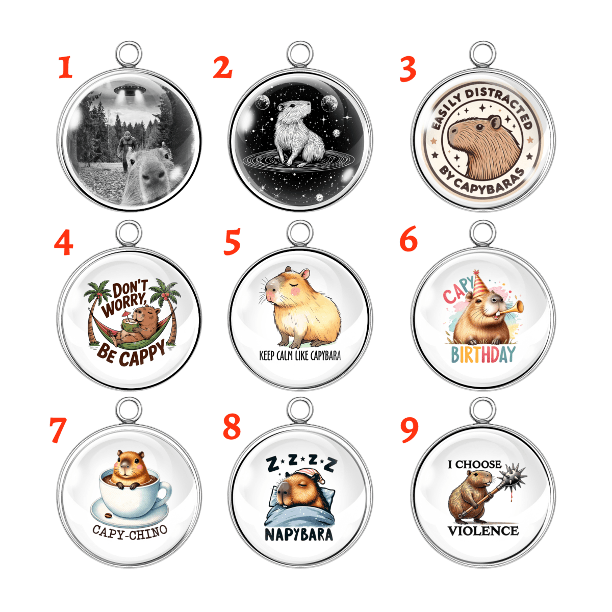Nine capybara-themed charms with various designs on a white background