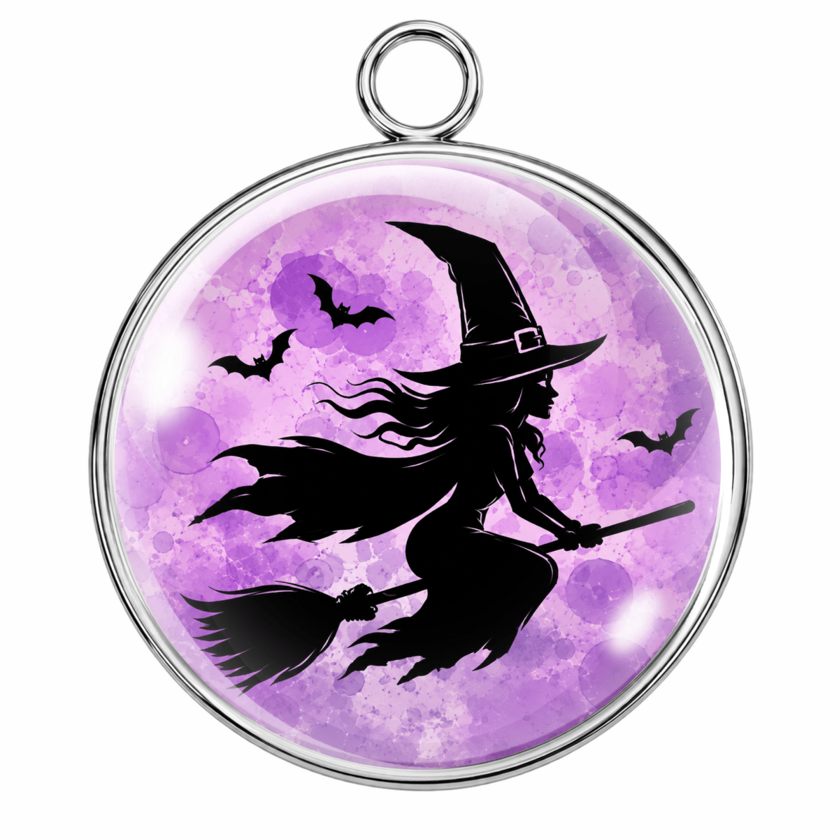 A round pendant with a silver-tone metal border and hanging loop, featuring a black silhouette of a witch riding a broomstick against a purple watercolor moon background with small bat silhouettes.