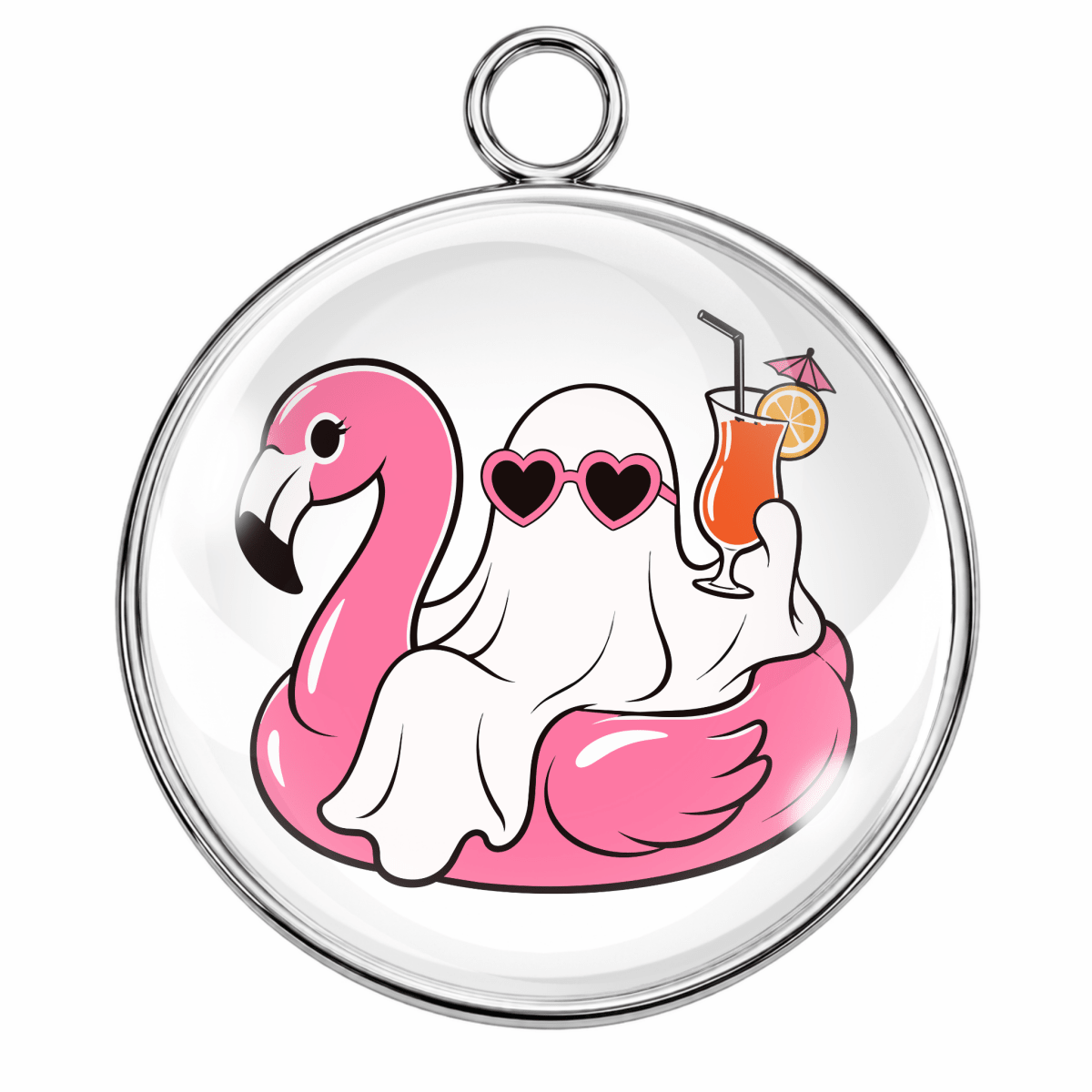 A round silver-toned pendant or charm with a clear domed surface, featuring a cartoon illustration of a pink flamingo, a white ghost wearing heart-shaped sunglasses, and an orange cocktail in a glass.