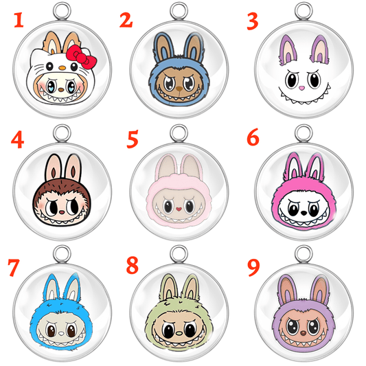 A set of 9 colorful Labubu-style bunny face charms with different facial expressions and cute character hoods, handmade as round glass cabochon charms.