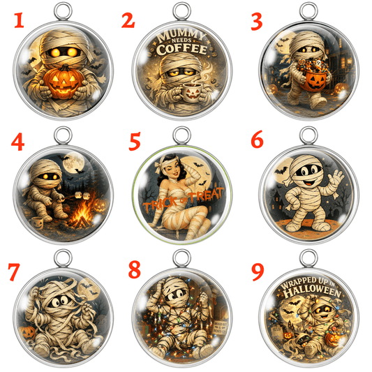 Nine Halloween-themed round pendant designs arranged in a 3x3 grid on a white background, each with a red number label in the top-left corner. The pendants feature cartoon mummies in various spooky poses, including holding pumpkins, sitting by a campfire, with a moon and stars, and one mummy wrapped in autumn leaves.