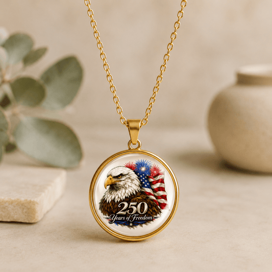 Gold necklace with a pendant featuring an eagle and American flag design on a neutral background.