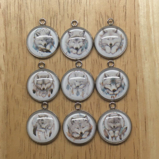 video of 9  wolf dreamcatcher glass cabochon charms