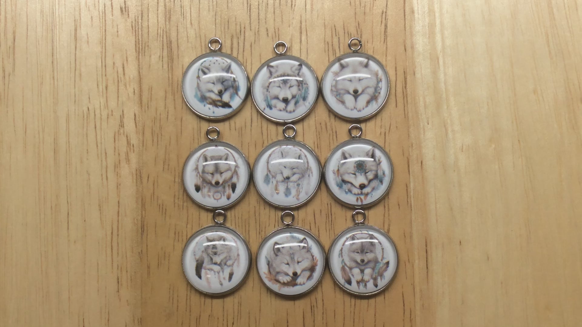 video of 9  wolf dreamcatcher glass cabochon charms