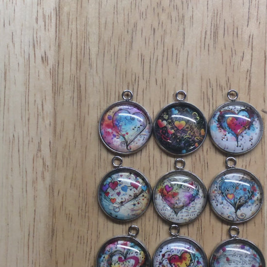 video of 9 glass cabochon charms with Colorful hearts and musical notes