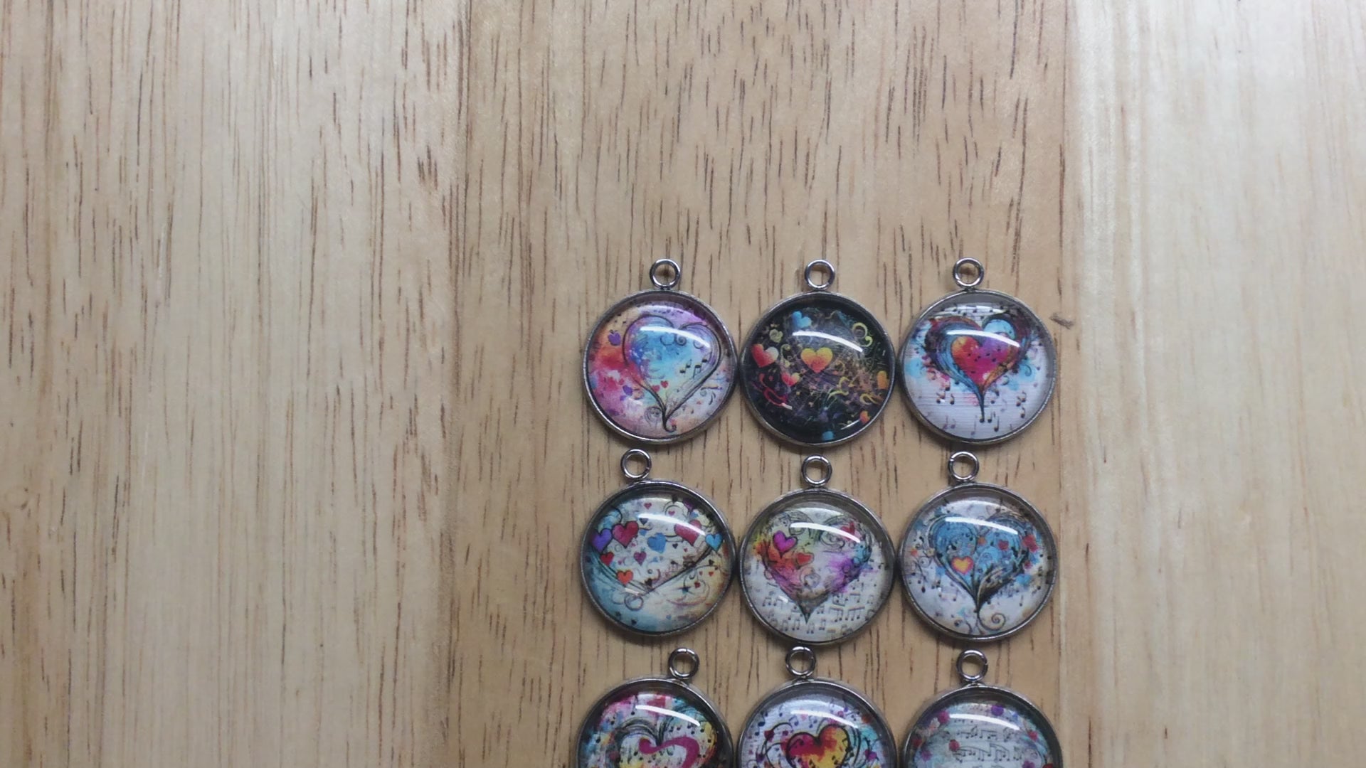 video of 9 glass cabochon charms with Colorful hearts and musical notes