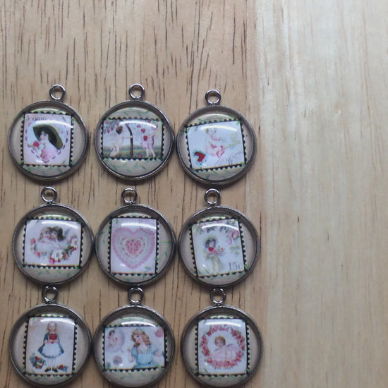 Video of 9 glass cabochon charm with picture of a vintage valentine stamp