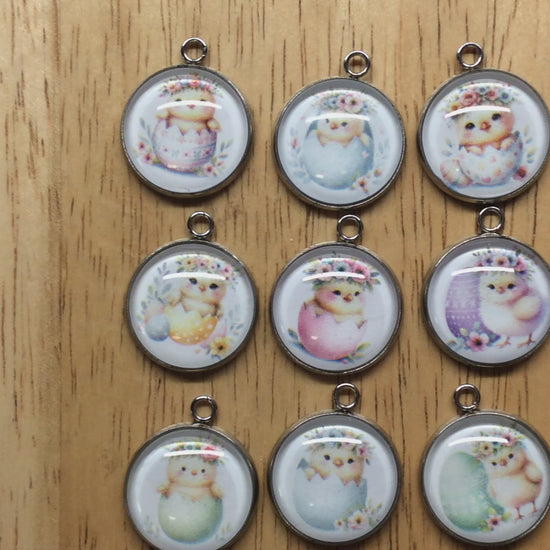 video of9 glass cabochon charms with baby chicks inside