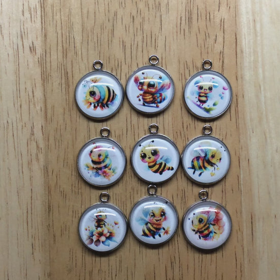 video of glass cabochon charms with a cute bumble bee images