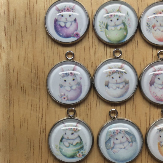 video of 9 glass cabochon charms with bunnies inside easter egg