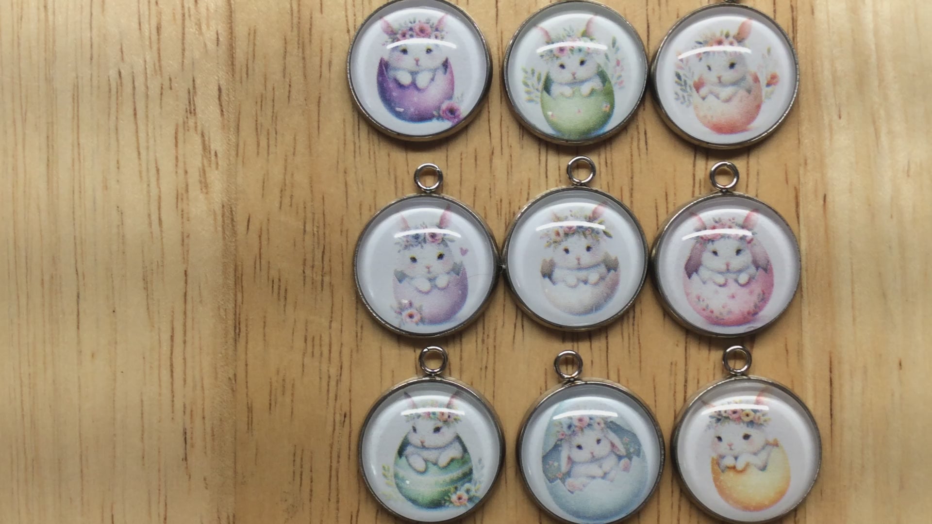 video of 9 glass cabochon charms with bunnies inside easter egg