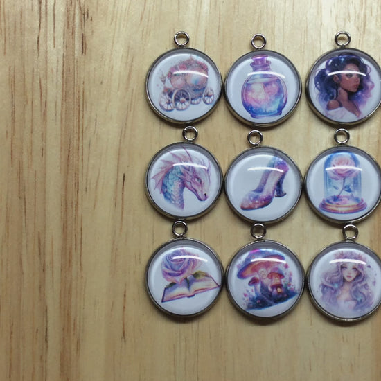 video of 12 fairytale themed glass cabochon charms