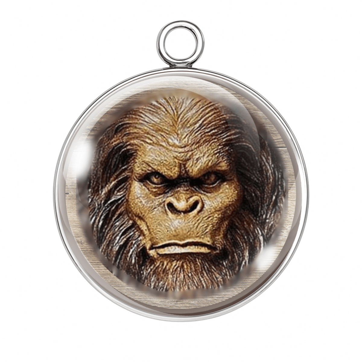 Realistic Bigfoot head illustration glass charm with intense stare