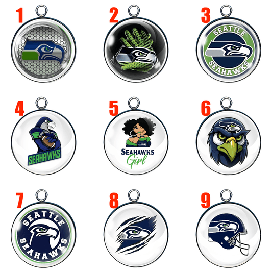 “A grid of nine round glass cabochon charms (each with a small metal loop) featuring various Seattle Seahawks–themed designs on a white background. Each charm is numbered in red in the top-left corner from 1 to 9.”