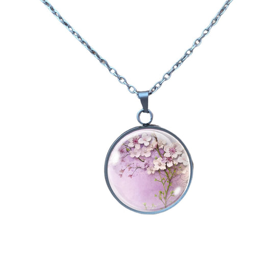 Necklace featuring a charm with Pink spring flowers 