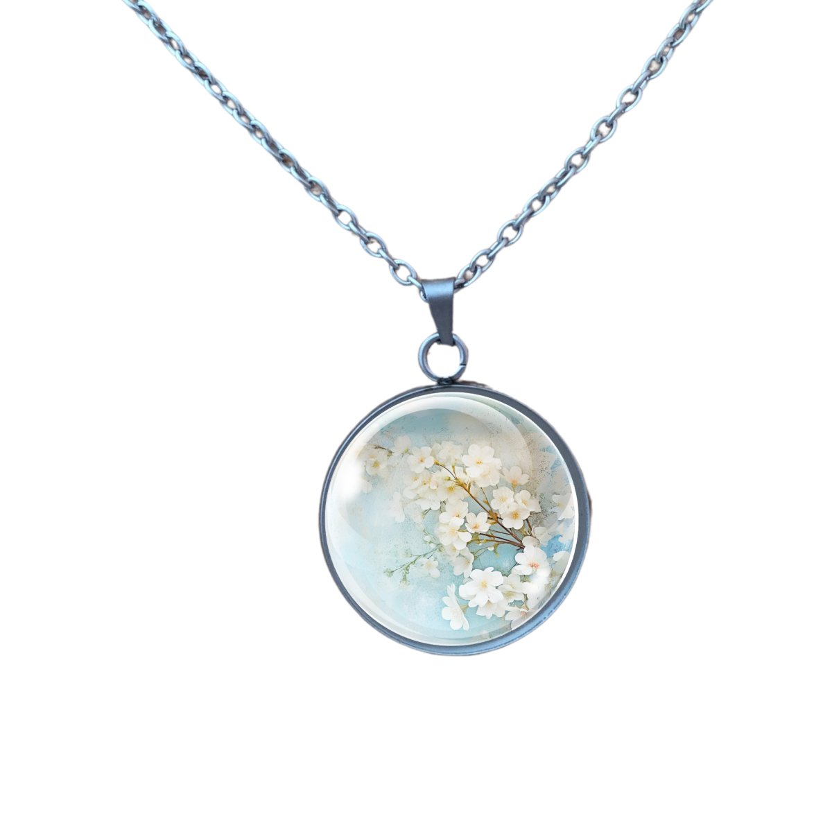 Necklace featuring a charm with white spring flowers on a light blue background