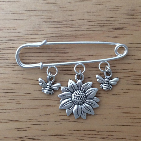 stainless steel lapel pin with two honey bee dangle charms and one sunflower dangle charm