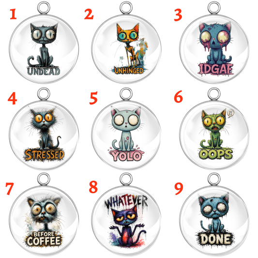 Nine cat-themed pendants with humorous text labels on a white background