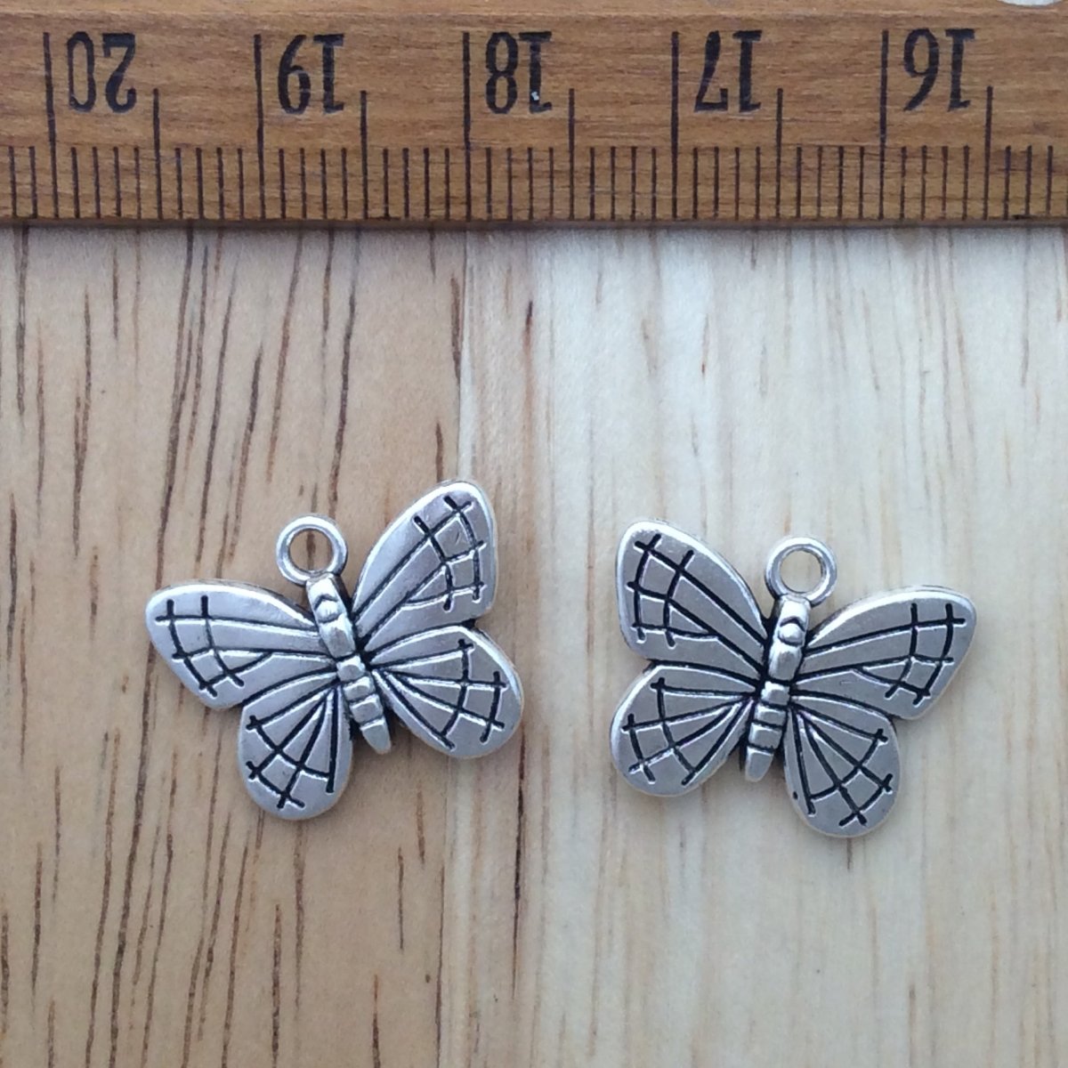 2 tibetan silver butterfly charms