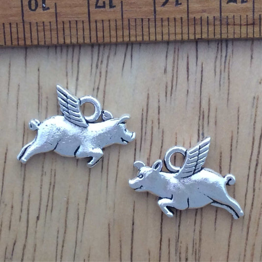 2 tibetan silver flying pig charms