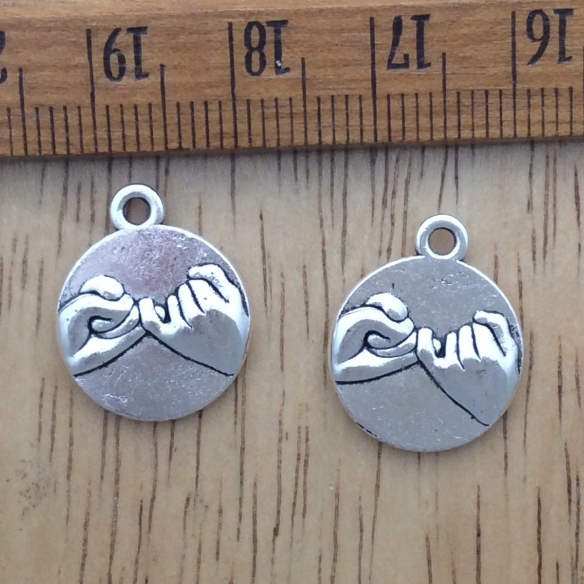 2 tibetan silver pinky swear charms