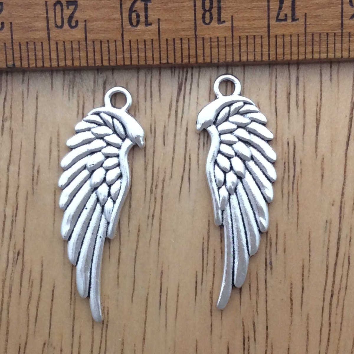 2 tibetan silver angel wing charms