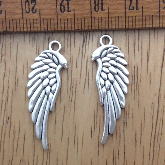 2 tibetan silver angel wing charms