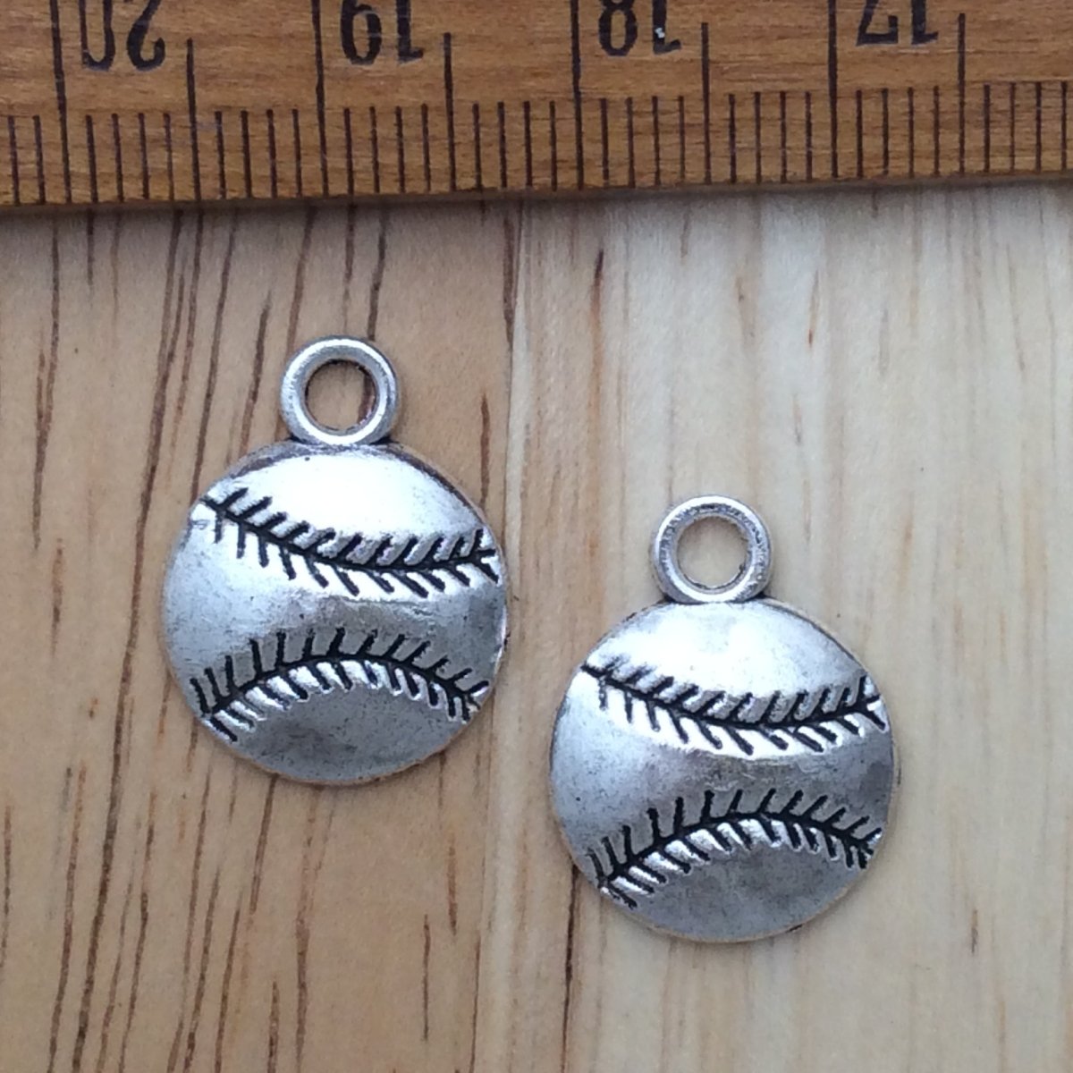 2 tibetan silver baseball charms