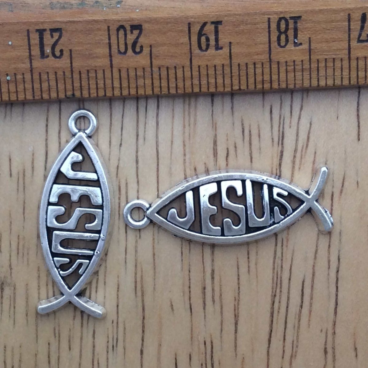 2 tibetan silver Jesus fish charms