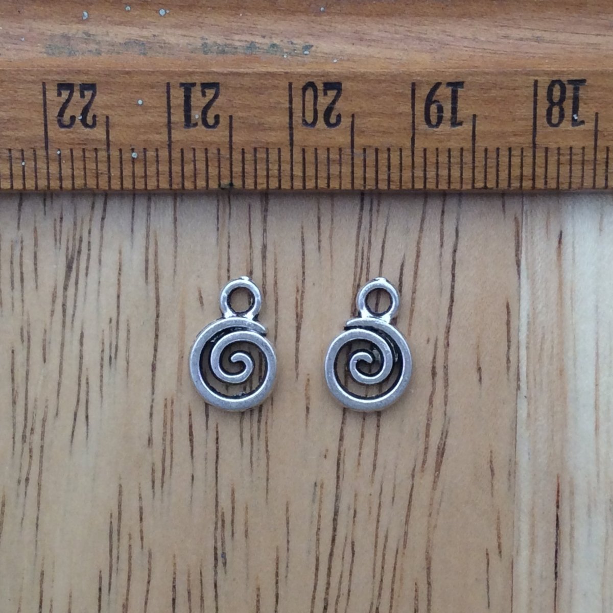 2 tibetan silver spiral charms