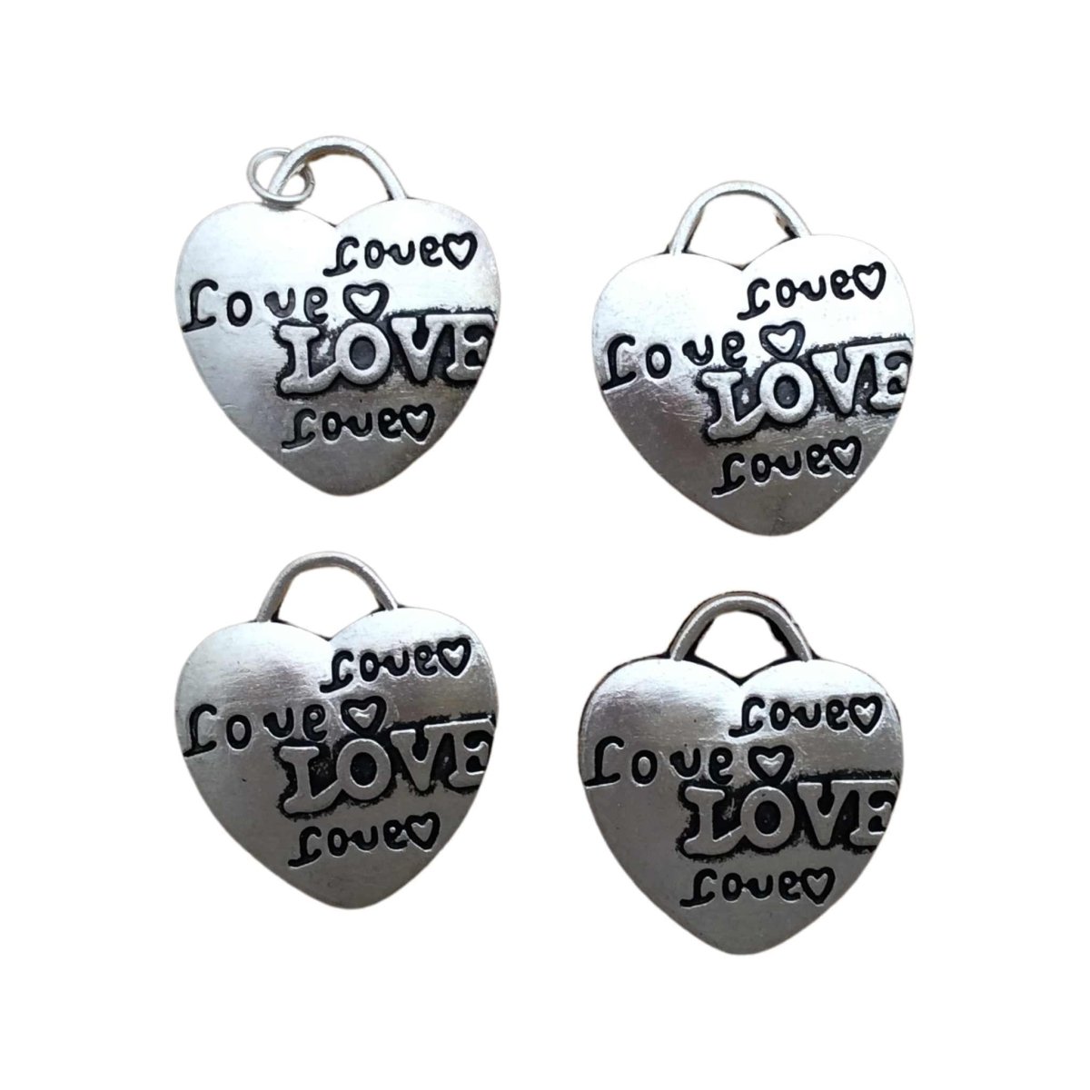 4 tibetan silver heart charms with the word"Love" 4 times with hearts on each charm 