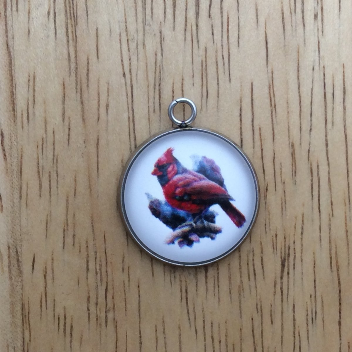 glass cabochon charm with a beautiful red and black cardinal