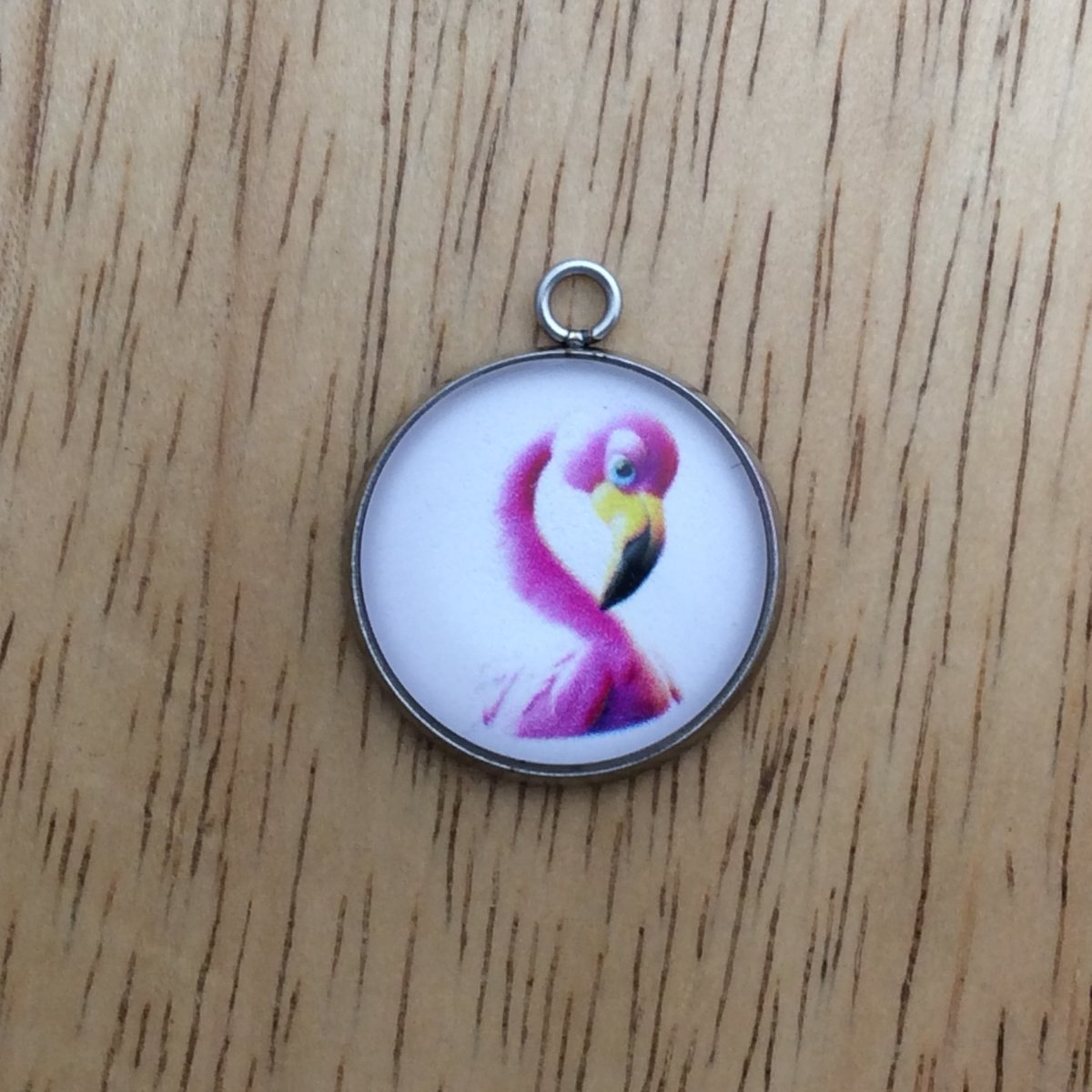 glass cabochon charm with a pink flamingo