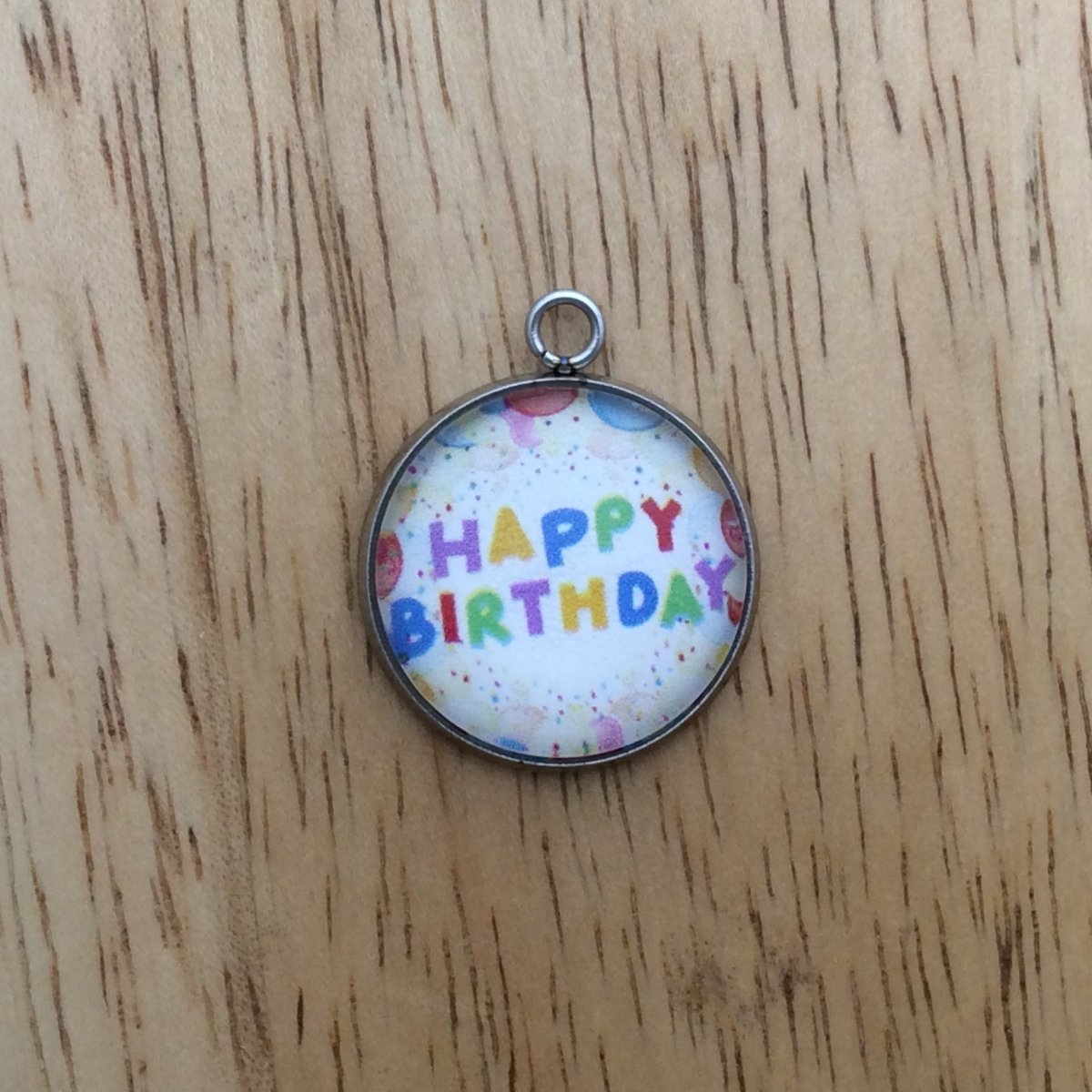 glass cabochon charm whith balloons and says happy birthday