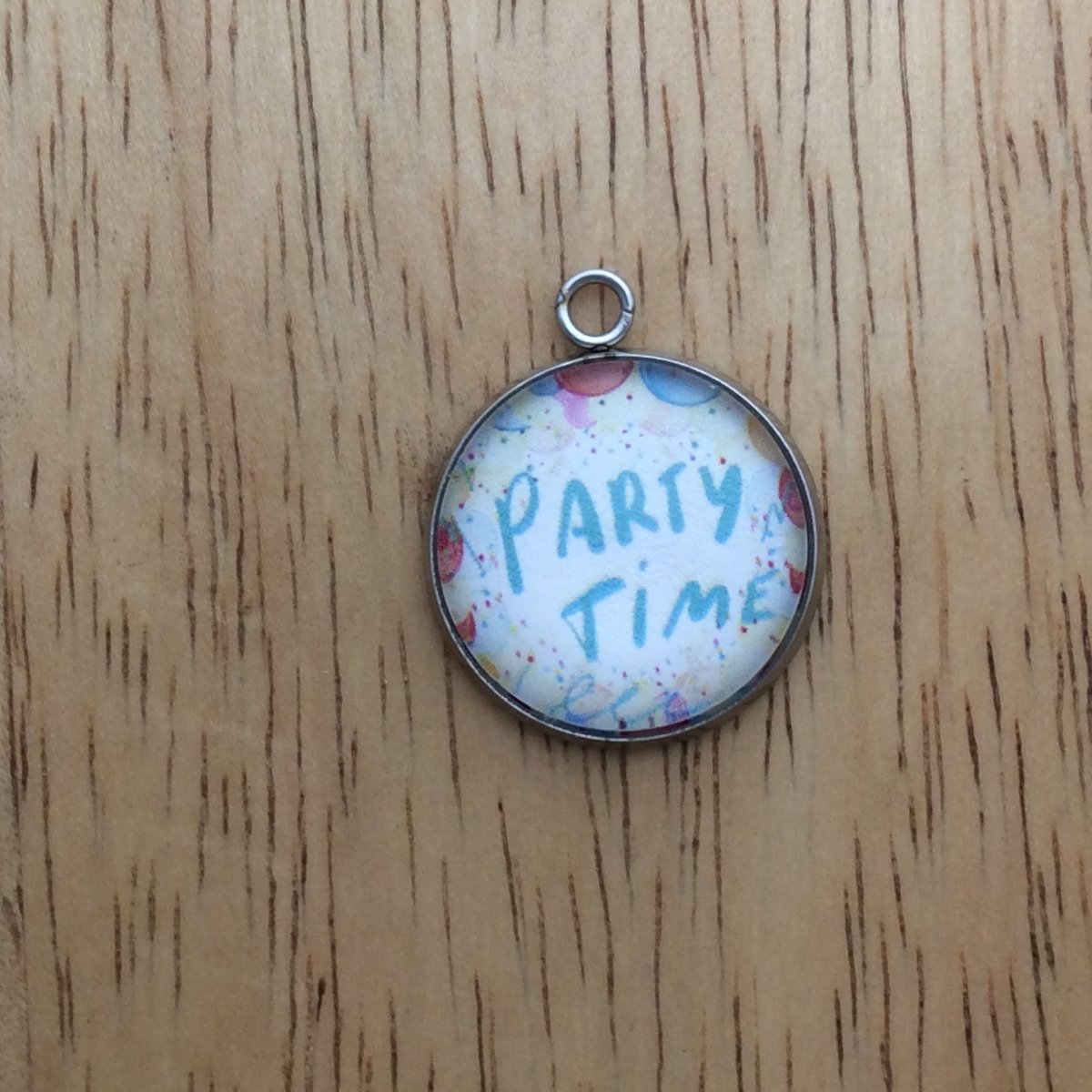 glass cabochon charm with balloons and says party time