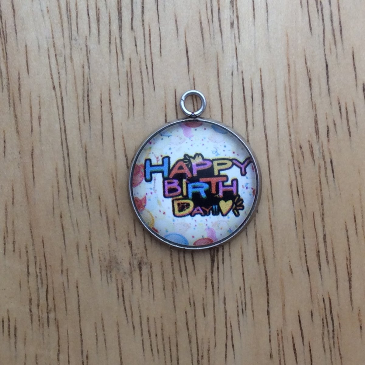 glass cabochon charm with balloons and says happy birthday