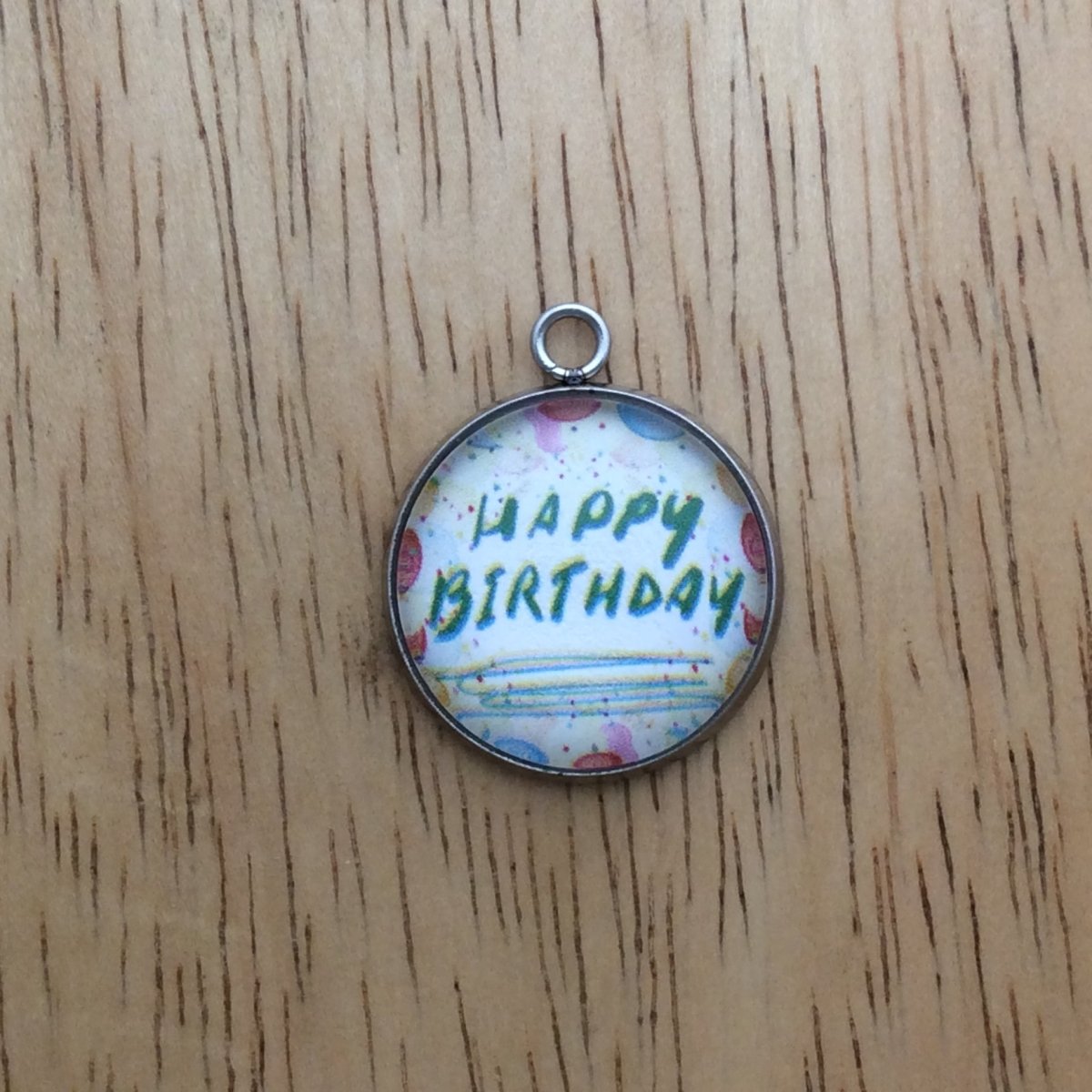 glass cabochon charm whith balloons and says happy birthday