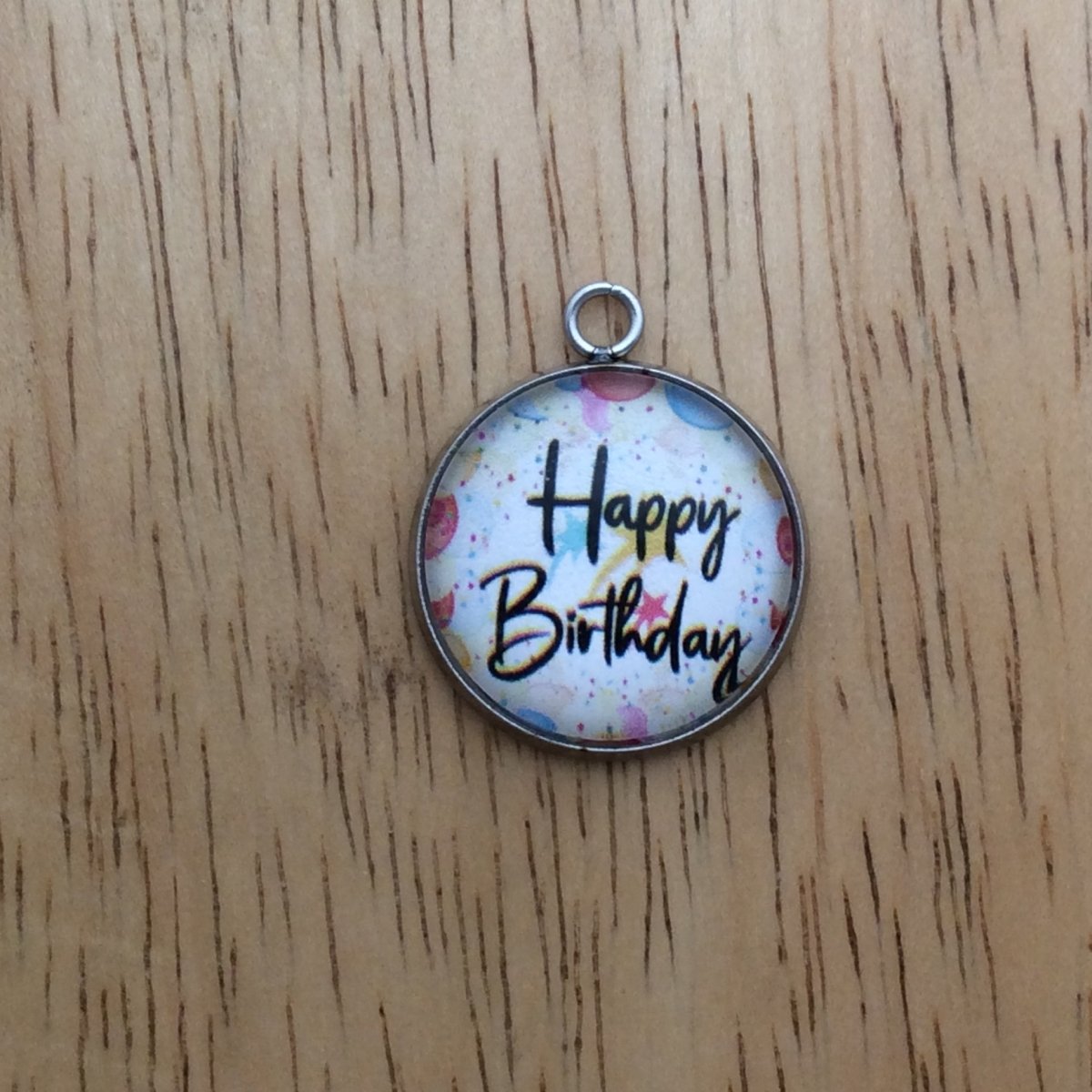 glass cabochon charm whith balloons and says happy birthday