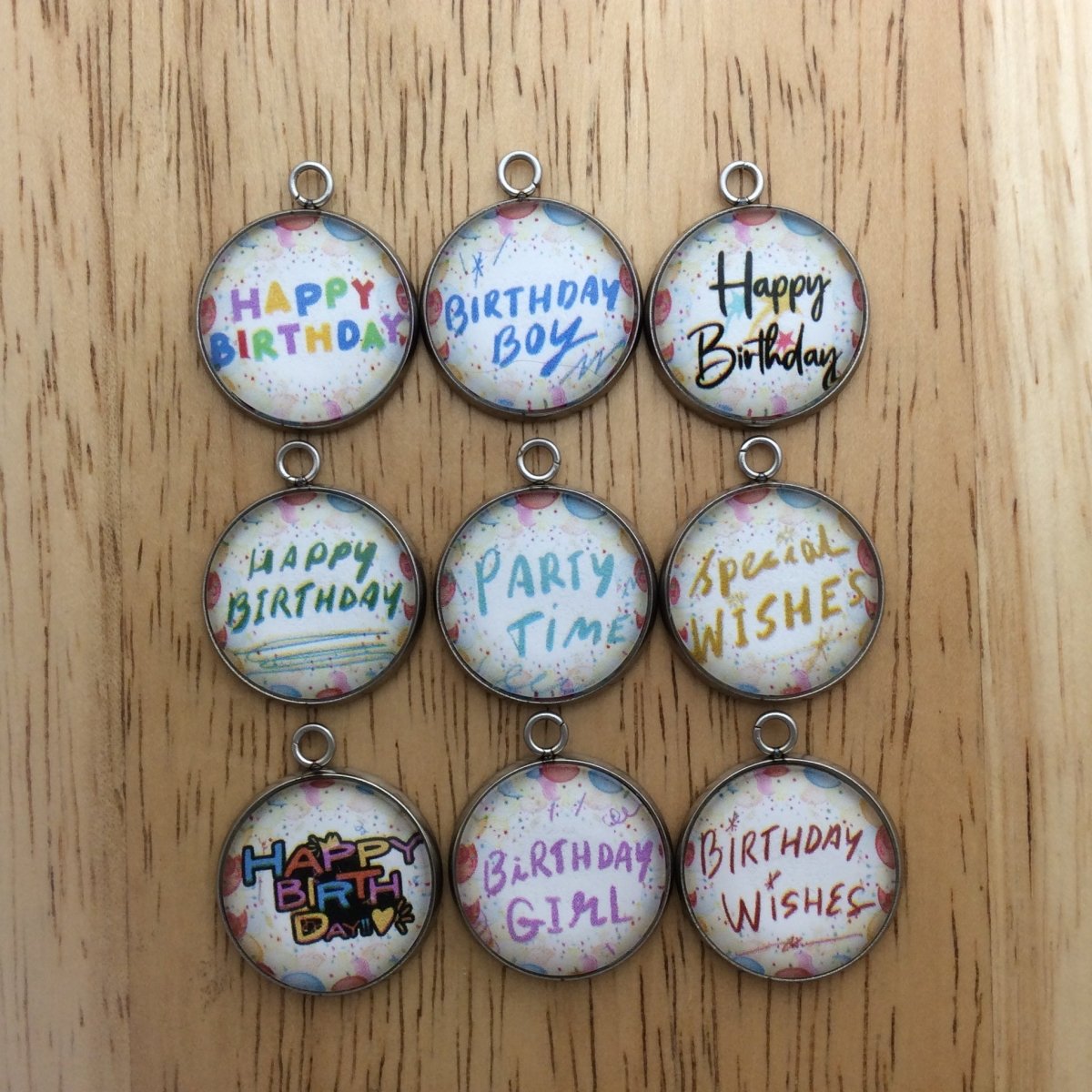 9 glass cabochon charms with happy birthday sayings