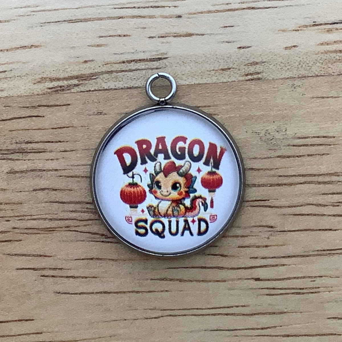 cute baby dragon with 'dragon squad' on it