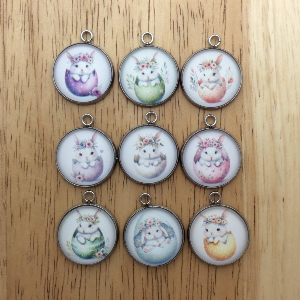 9 glass cabochon charms with bunnies inside easter egg