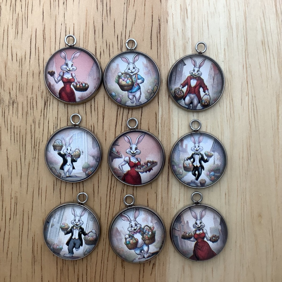 Group of 9 charms featuring the easter bunny dressed in tuxedos and fancy dresses to deliver the easter baskets