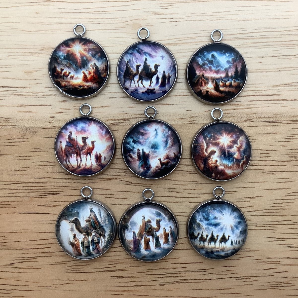 group of 9 charms featuring the 3 kings that visited Jesus in the manger