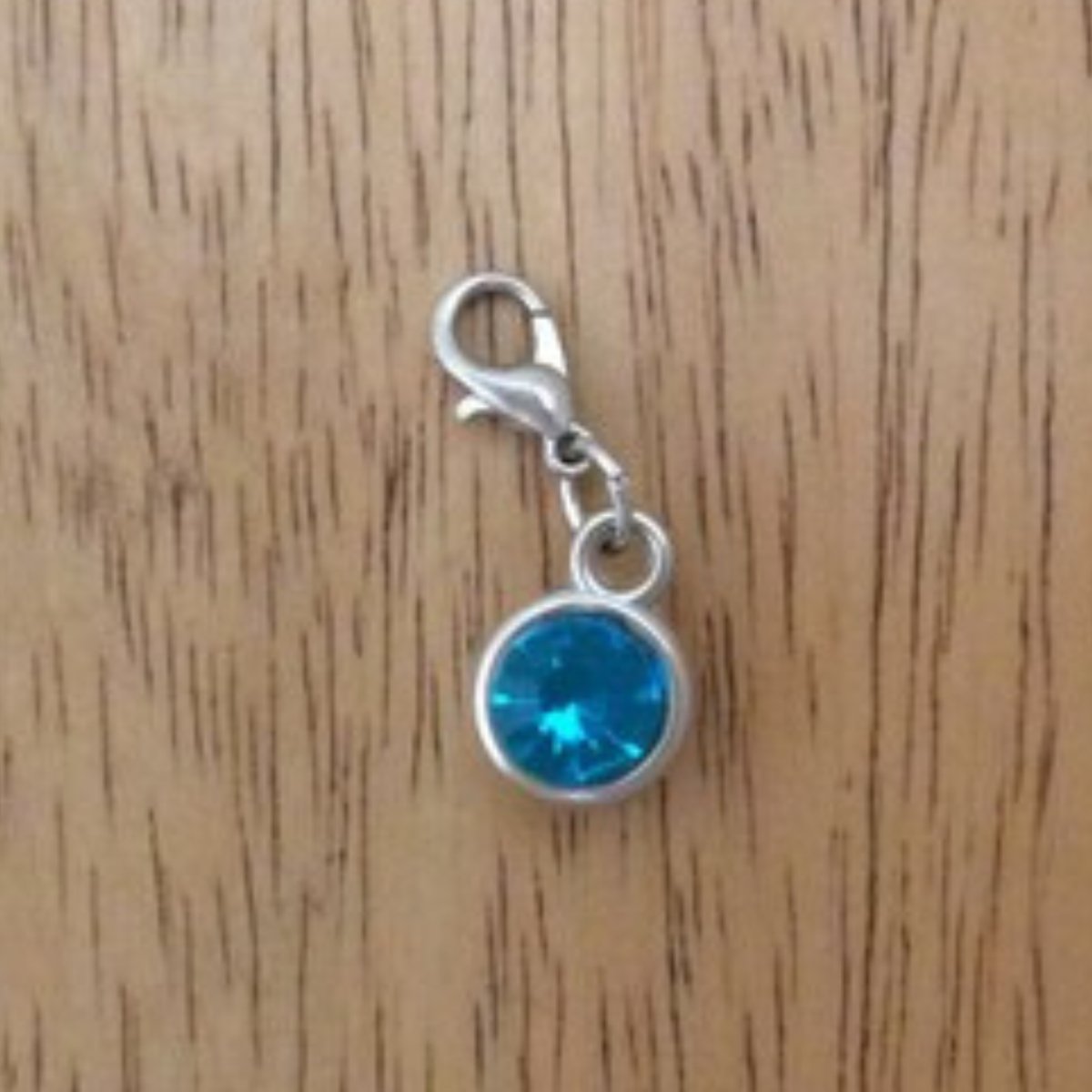 light blue gemstone charms with a lobster clasp