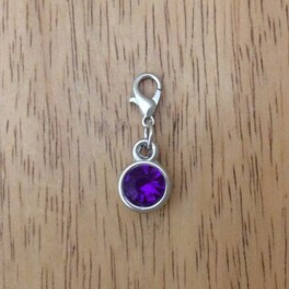 purple gemstone charms with a lobster clasp