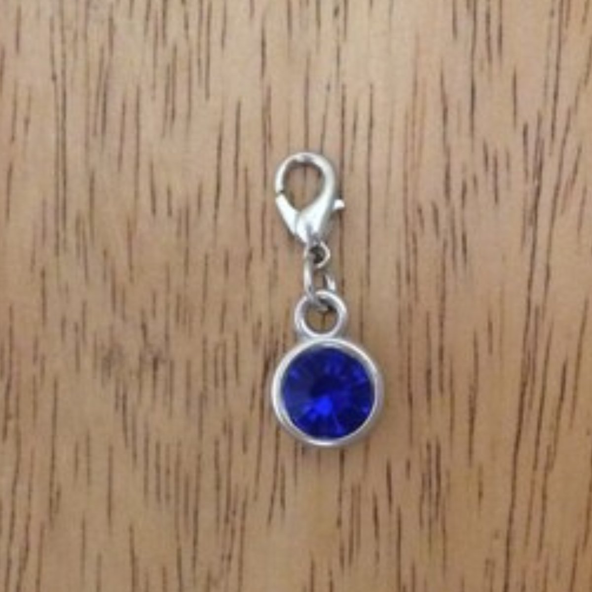 Dark blue gemstone charms with a lobster clasp