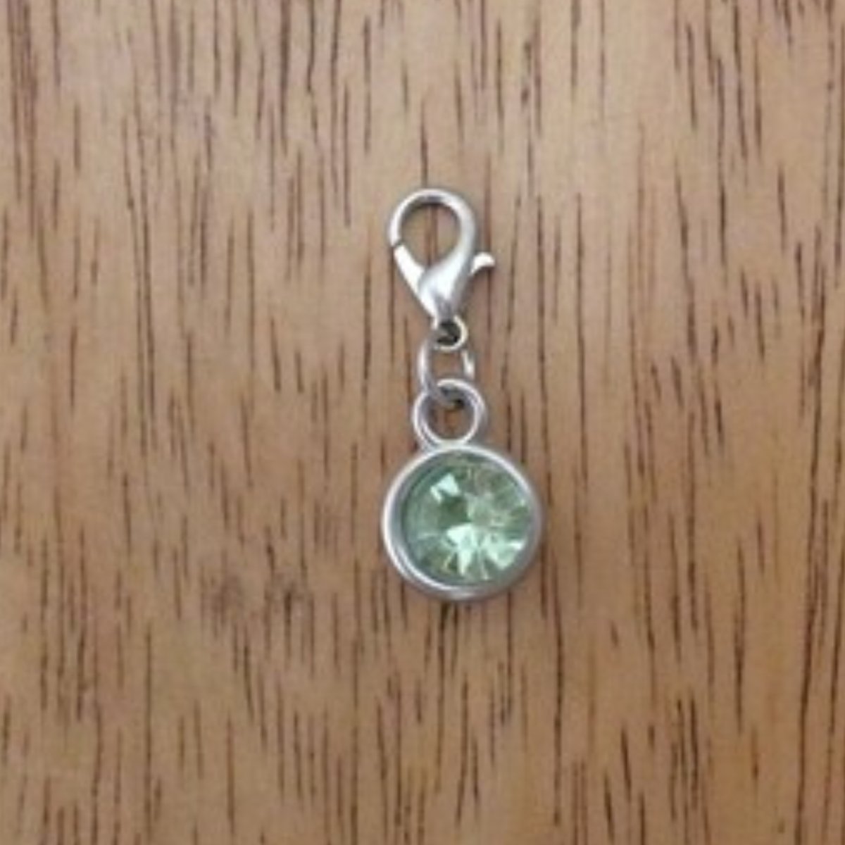 light green gemstone charms with a lobster clasp