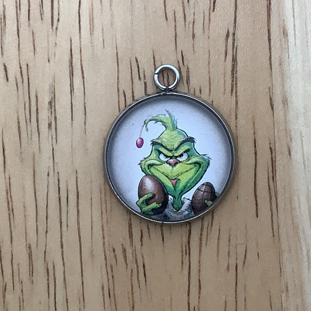 a grinchy looking character holding chocolate eggs