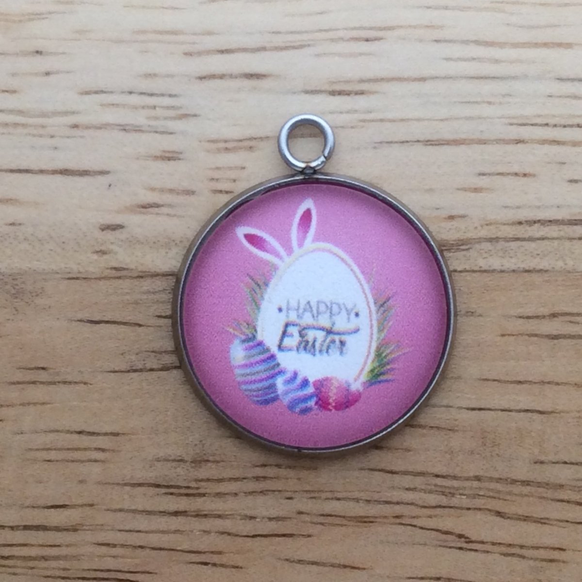 glass cabochon charm with easter eggs and says happy easter